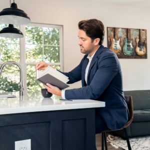 Professional reviewing notes representing a real estate checklist pack