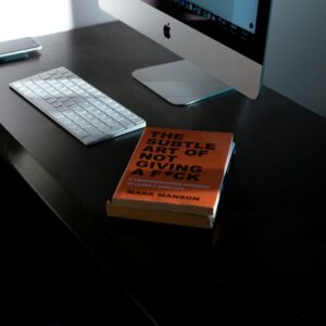 Books on a desk representing the MYCHI leadership reading list